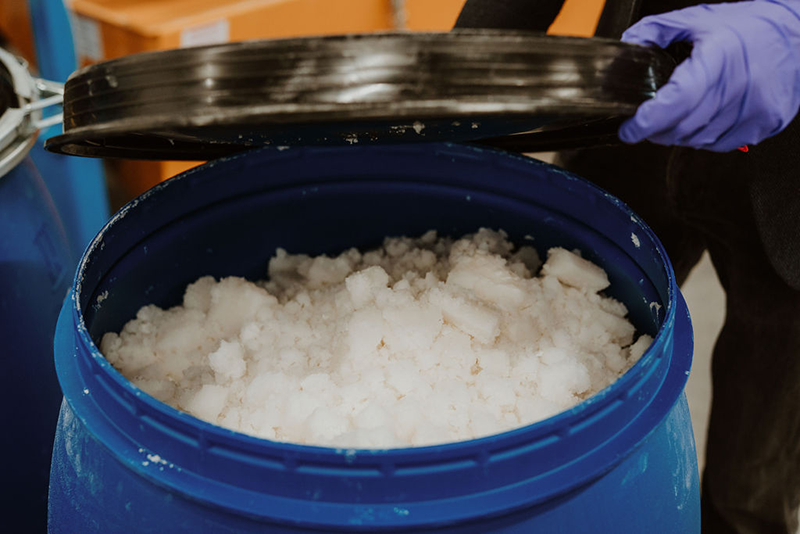 Plastic barrel filled with lithium carbonate material extracted by direct lithium extraction and crystallisation