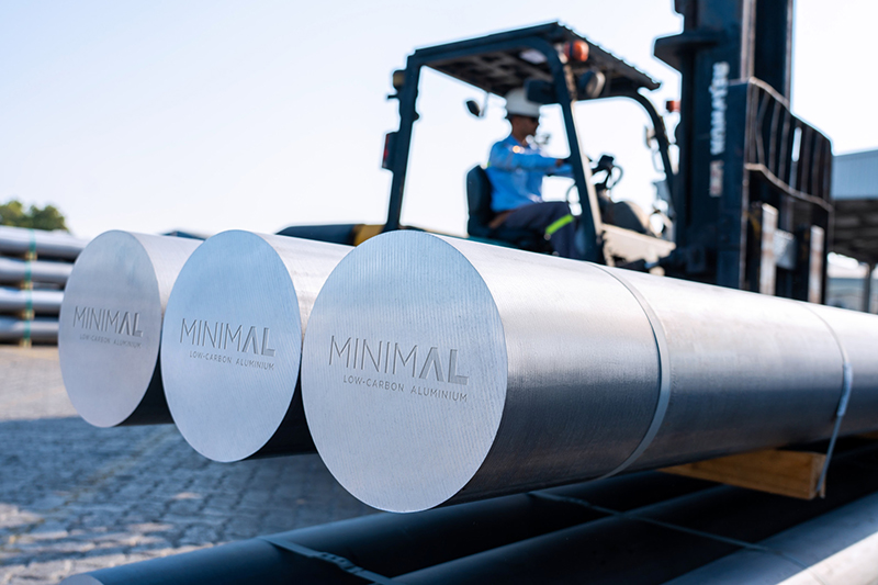 Large aluminium bars with name marked on the end, forklift to the rear
