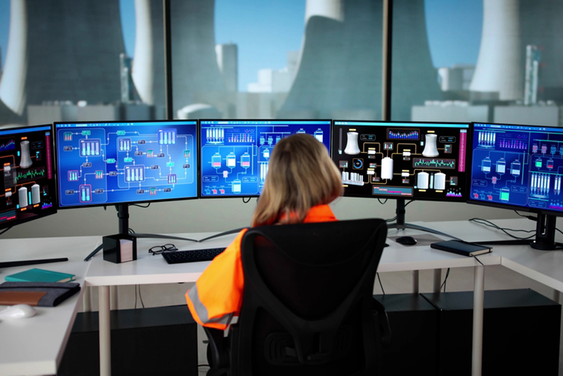 Female Engineer Operates SCADA System At Nuclear Power Plant