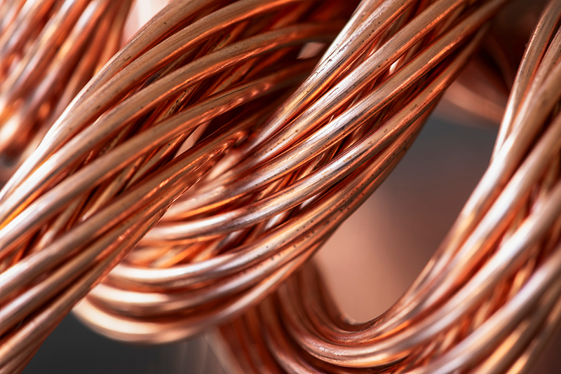 Stock image of raw copper material - copper wires twisted up together