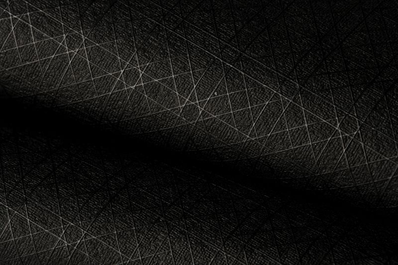 Modern Synthesis nanocellulose-based textile pictured in black with a diamond pattern