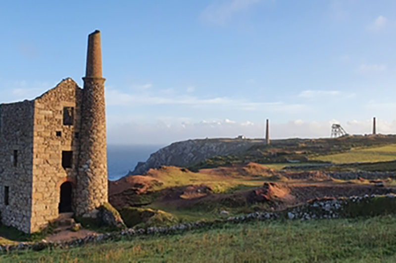 Picture of old stone building with chimney along the Cornish coastline