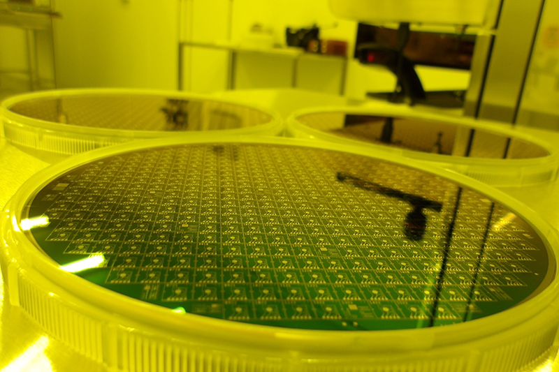 A zoomed in image of multiple six-inch graphene wafers sat side by side in a production facility