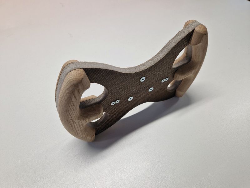 The all-cellulose composite steering wheel prototype pictured has a butterfly like shape and a two tone brown colour