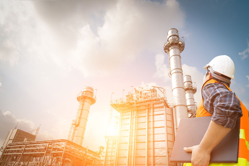 Engineer working and laptop at power plant