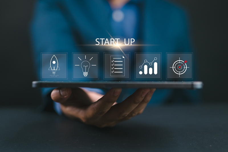 Icons depicting starting up a business - rocket, light bulb, rising bar graph, checklist, dart board hitting bulls eye