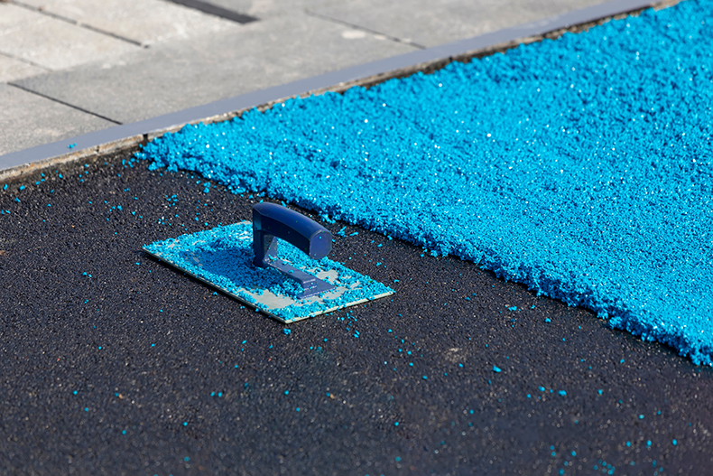 blue coating on top of black surface