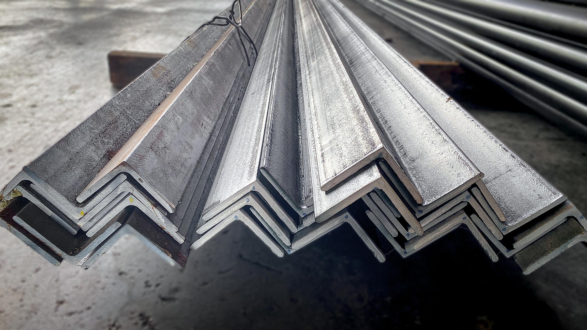 Steel angles piled together in an outdoor yard