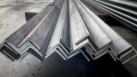 Steel angles piled together in an outdoor yard
