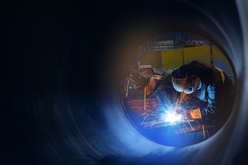Factory industrial weld worker in workplace with spark