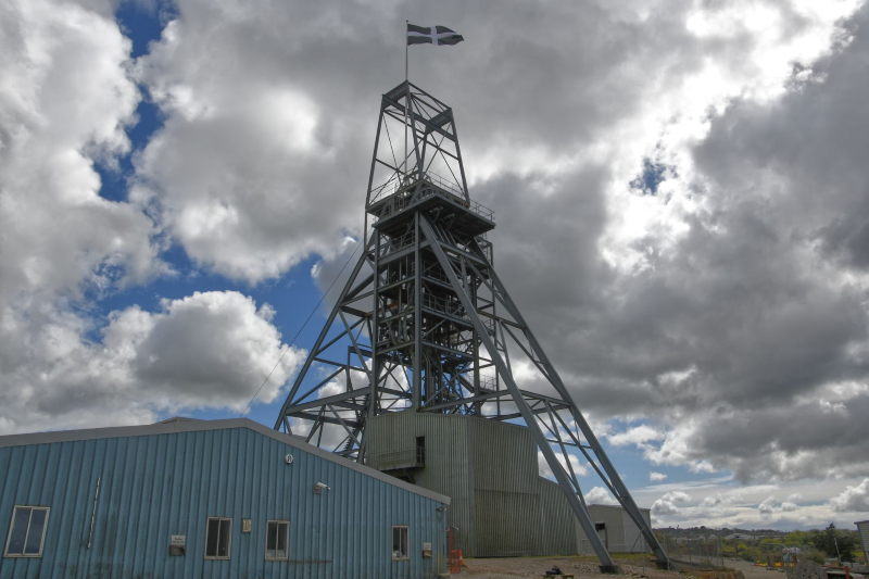 Mine tower with the flag of Cornwall flying from the top