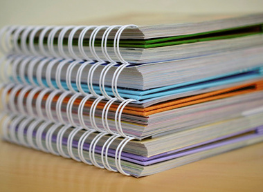 A stack of wire-bound documents
