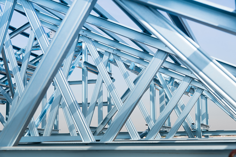 Iron and Steel structure against backdrop of blue sky