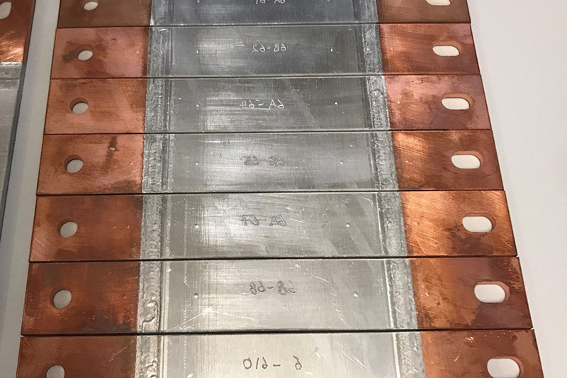 copped ends on aluminium plates, raised welding is visible where the metals join