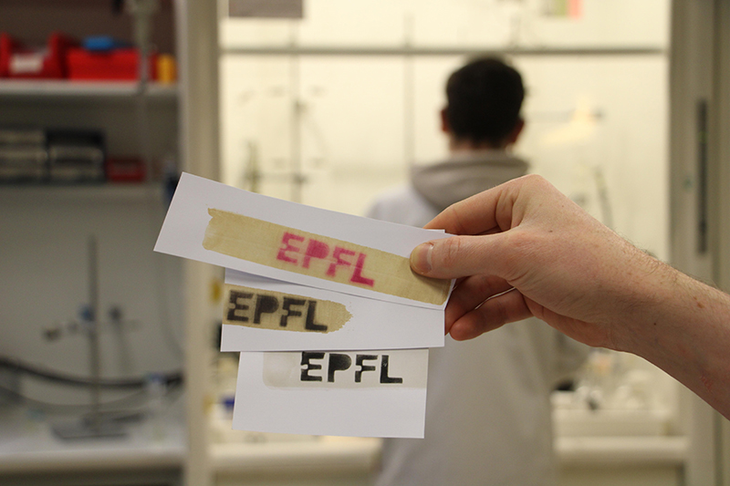 The EPFL logo printed three different ways on pieces of paper