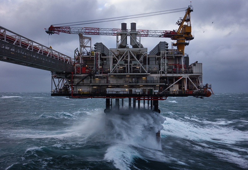 stormy waters surround an oil platform in the North Sea 