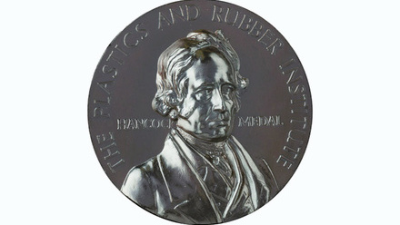 silver coloured medal raised lettering at edge reads The Plastics and Rubber Institute, centred image depicts Hancock flanked by his name