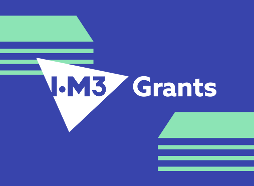blue rectangle with diagonally placed green lines indicating cash to either side and IOM3 logo in a white triangle with the word grants to the right
