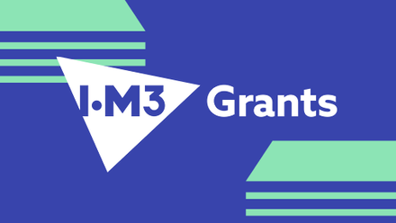 blue rectangle with diagonally placed green lines indicating cash to either side and IOM3 logo in a white triangle with the word grants to the right
