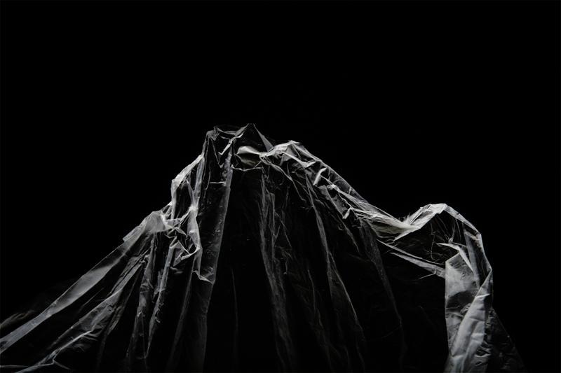 plastic sheet against black backdrop