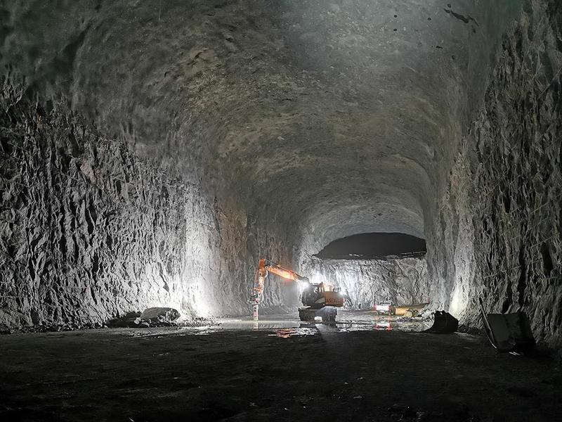 Digger digging in cave