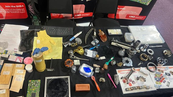 Range of materials samples displayed at the GUTS show on a black tablecloth