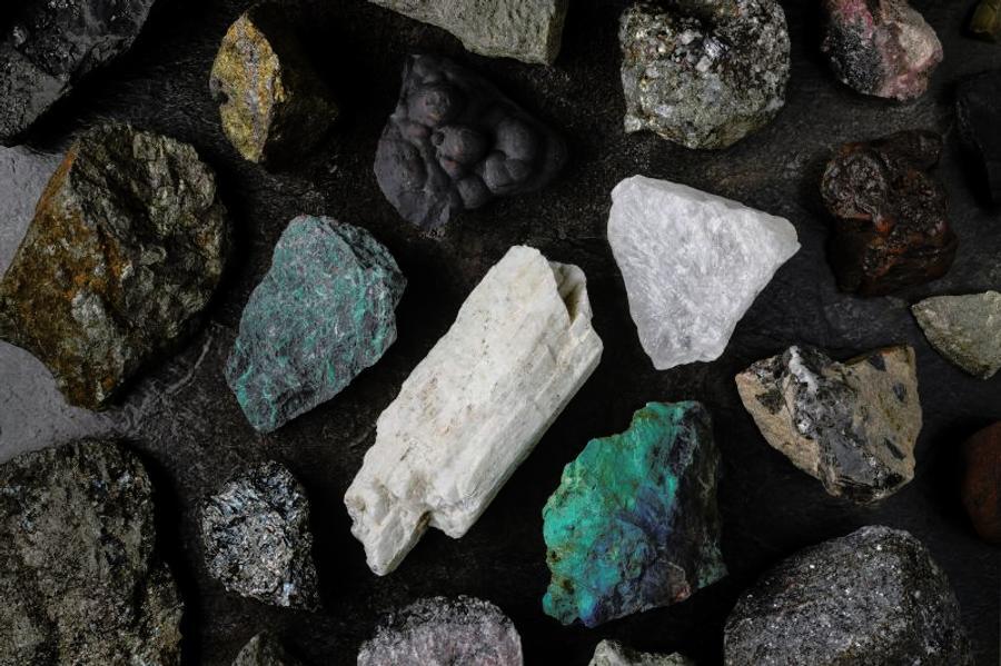 Mixture of critical minerals (United States of America definition), or critical raw materials (European Union definition). Flatlay on slate background pictured