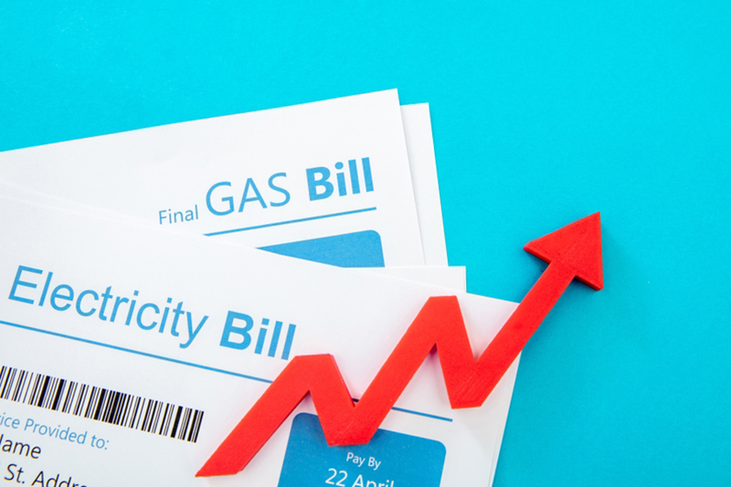 Utilities accounts and red rising up arrow, symbolises rising costs