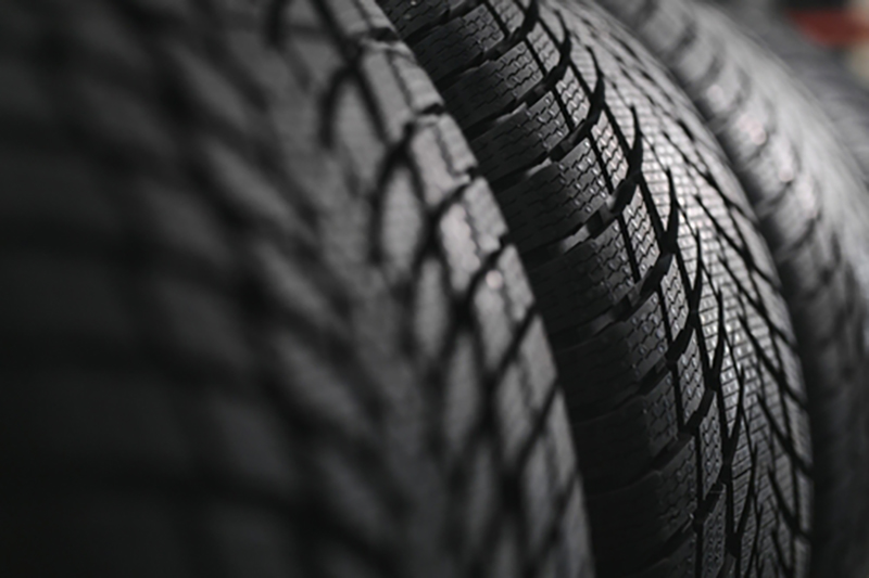 Close-up of a row of car tyres