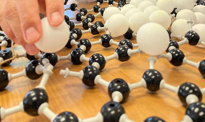 using chemical model structure to show how atoms fit vaccancies