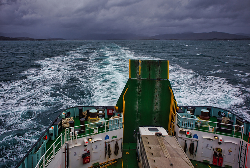 Vehicles on board Isle of Skye bound ferry, showing sky and water