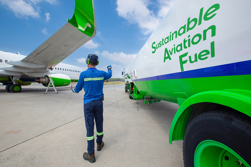 Sustainable Aviation Fuel (SAF). Technician refueling private jet with SAF at anairport