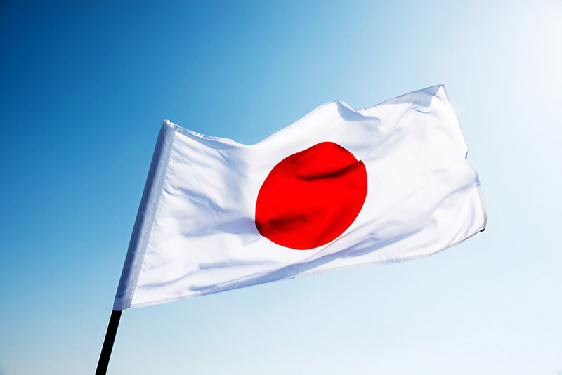 Japan flag against blue sky