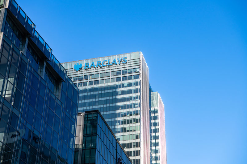 A view of a building with the Barclays logo on top