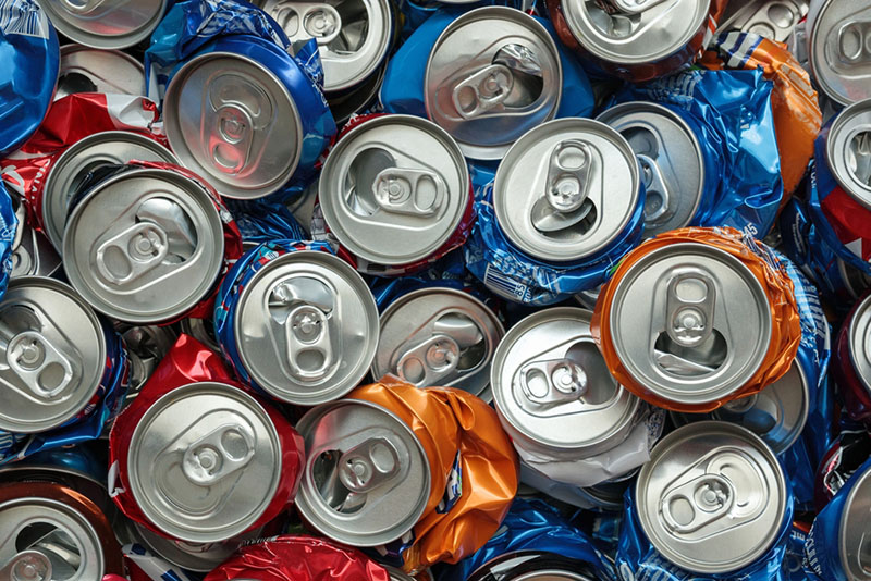 Close up of crushed aluminium cans in different colours